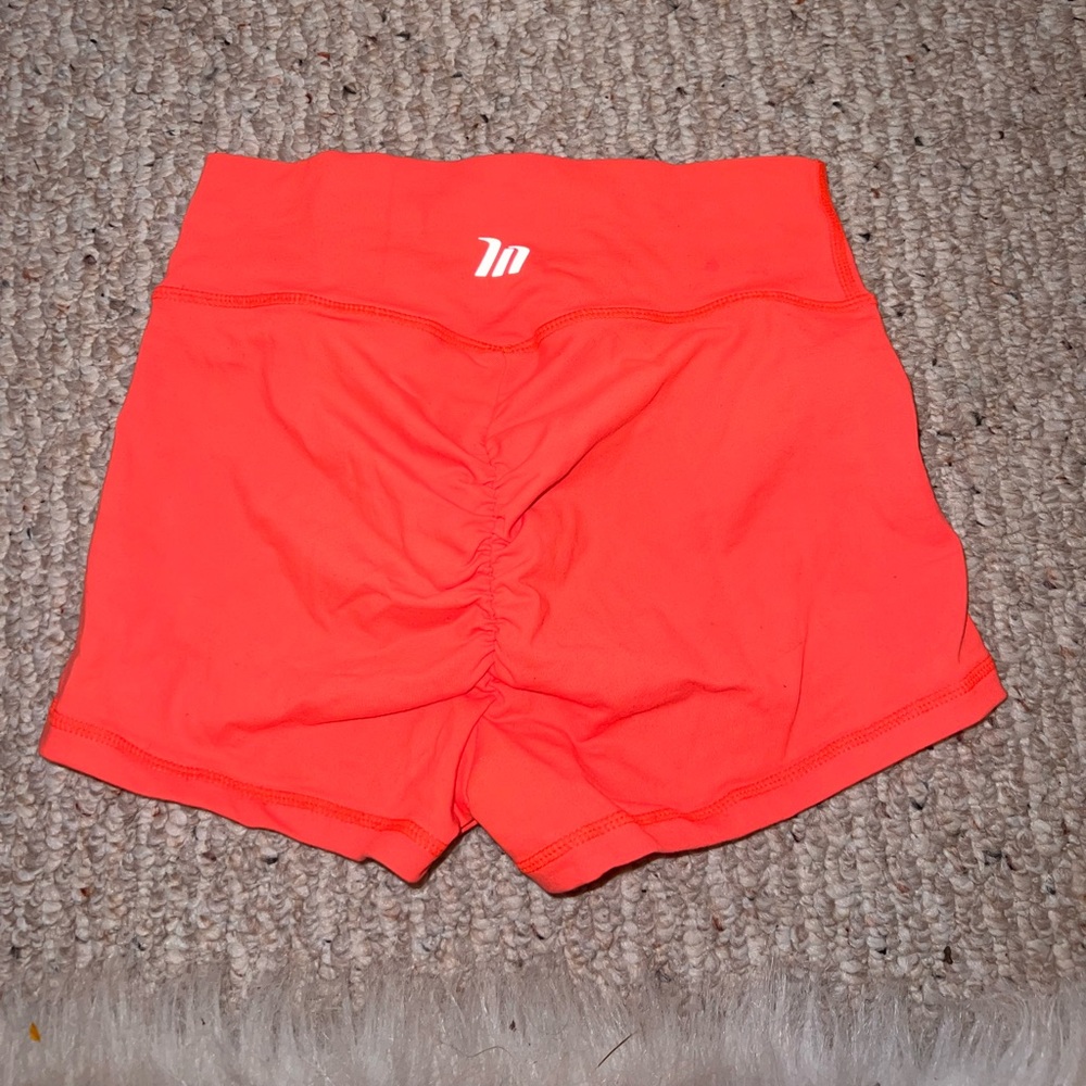 Muscle nation neon orange shorts